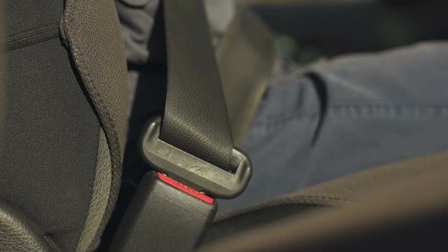 Driver inserts seatbelt