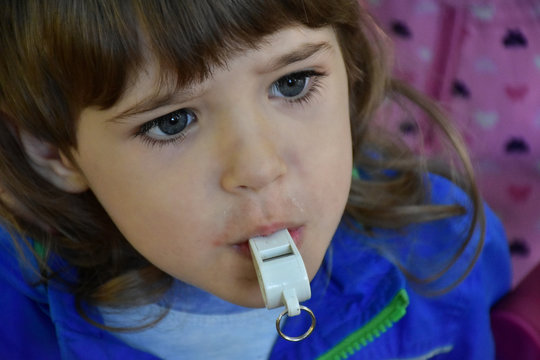 baby and whistle in the park
