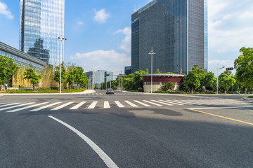 empty asphalt road front of modern buildings.