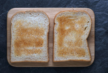 Toasted bread on wooden board