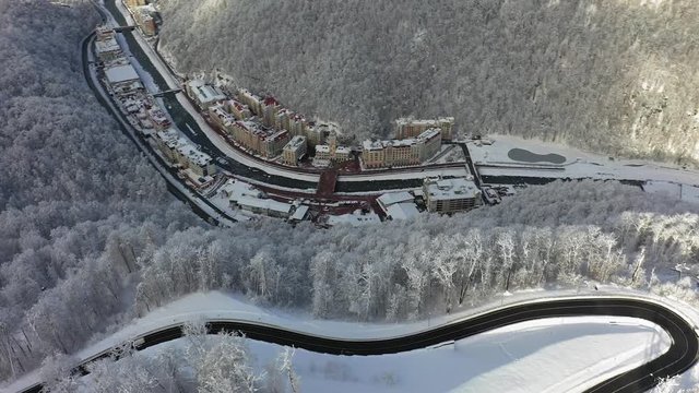 Sochi, Russia, 11-01-2018. Aerial photography with quadcopter. Rosa Khutor ski resort, Sochi, Krasnaya Polyana. Winter forest, nature of the Caucasus, hotel on the banks of the river Mzymta. 