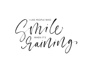 I like people who smile when it's raining phrase handwritten with a calligraphic brush.