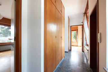 Corridor and interior with wardrobe in country house