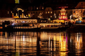 Christmas market at night with reflections at Vilshofen-Danube-Bavaria-Germany