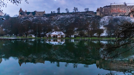 Fototapeta na wymiar Beautiful sunset with reflections and the longest fortress in the world at Burghausen-Bavaria-Germany