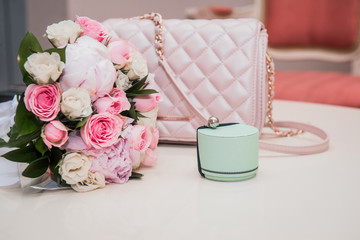 mint ring box, wedding bouquet of pink roses and peonies, pink handbag