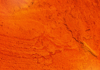 natural texture of a cracked red ocher wall