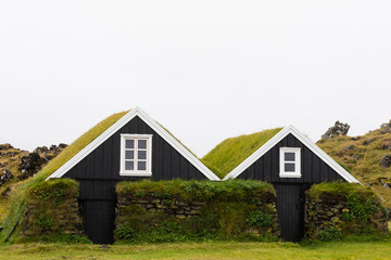 Historic farm house buildings with taditional grassy turf roof architecture in Hellissandur, Iceland, IS, Europe