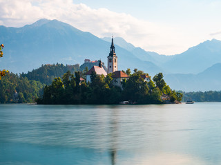 Long exposure of Lake Bled Slovenia, early morning, cloudy day, reflections in the water, side view...
