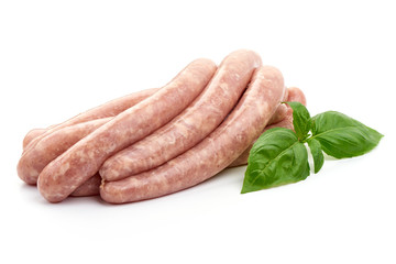 Delicious Raw Sausages for barbecue with basil leaf, close-up, isolated on white background