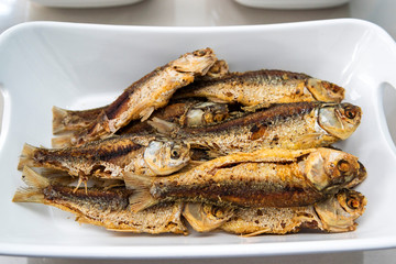 Indonesian food ikan goreng or fried fish in restaurant