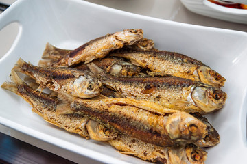 Indonesian food ikan goreng or fried fish in restaurant