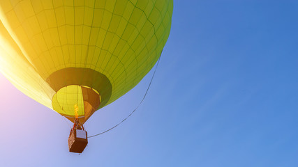 Hot air balloon flight view from below in the blue sky