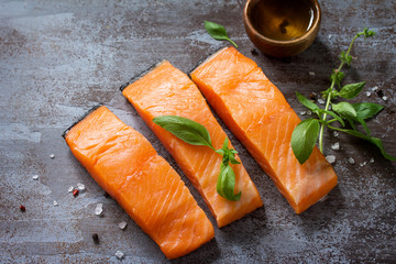Fresh Fish. Raw Salmon Fillet on a dark stone table. Copy space.