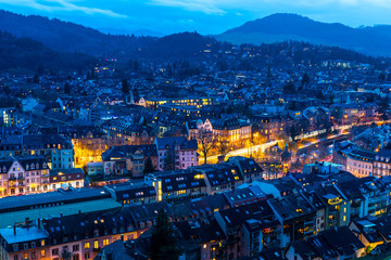 Naklejka premium Germany, Freiburg im Breisgau from above in stunning blue hour atmosphere in winter