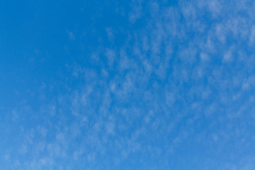 Fototapeta na wymiar White clouds against the blue sky for scenery of an image or article about ecology.