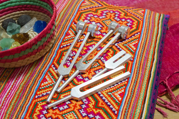 Hand holding a tuning fork .