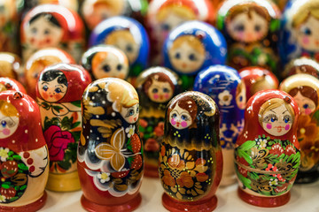 Nesting wooden dolls. Colorful Russian matryoshka at the souvenirs market