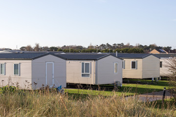 Modern beach holiday homes. A row of seaside vacation lodges