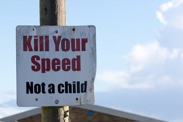 Kill your speed not a child road sign. School safety traffic calming notice.