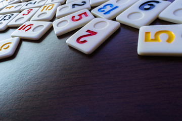 rummy pieces placed randomly on the table.