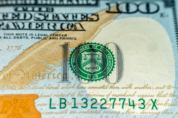 Macro shot (closeup ) of a new 100 dollar bill Series 2009 A. Seal of department of the treasury