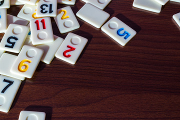 rummy pieces placed randomly on the table.