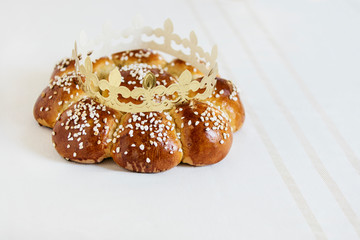 King Cake or King Bread, called in German language Dreikönigskuchen, baked in Switzerland on January 6th,. Small plastic figure is hidden inside. The person, who finds it, is the king of the day