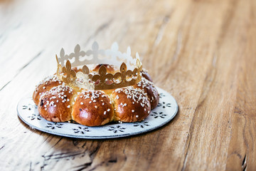 King Cake or King Bread, called in German language Dreikönigskuchen, baked in Switzerland on January 6th,. Small plastic figure is hidden inside. The person, who finds it, is the king of the day