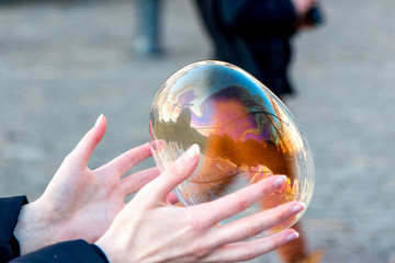 catching bubbles.