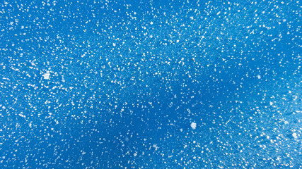 snow on blue background