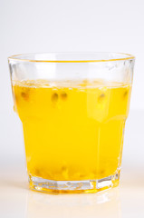 Glass of passion-fruit Juice on white background