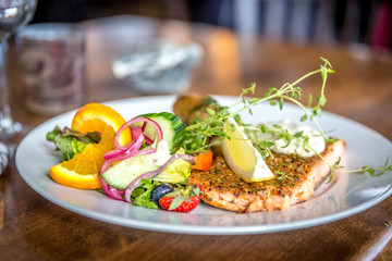 Beautiful salmon plate with salad in Norway