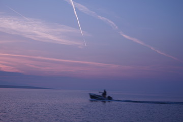 Fishing boat on violet sea