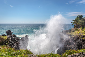 Wave splashing in the rocks in Jeju island