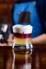 Bartender finished decorating his cocktail in bar