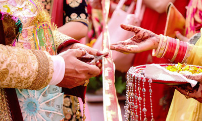 Cutting Ribbon in Indian Wedding Ritual Welcome Ceremony