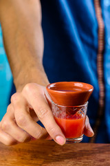 Bartender finished decorating his cocktail in bar