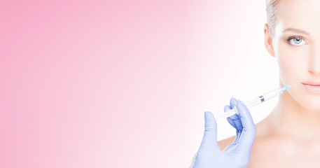 Doctor injecting in a beautiful face of a young woman. Plastic surgery concept.