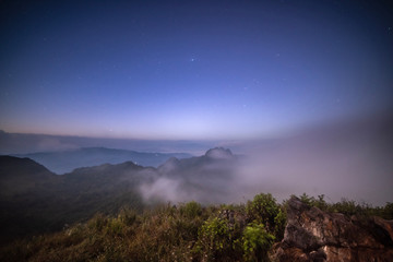 Stars on the top of a mountain covered with fog