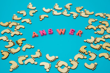 Answer Search Concepts. Concepts search answer. footprints and the word answer on a blue background.