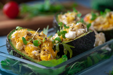 Healthy breakfast. Avocado, omelet and arugula.