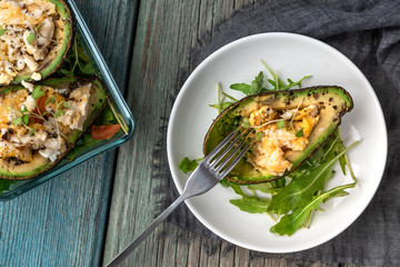 Healthy breakfast. Avocado, omelet and arugula.