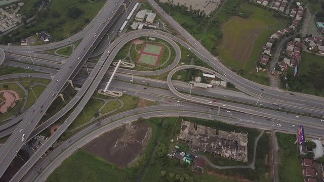 Fly above urban road highway aerial scene in day light, 4k videos, pollution in City of Bangkok, Thailand