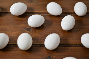 Organic white eggs on wooden table