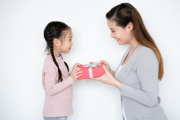 Asian mom delivers red gift box to daughter On the birthday is to deliver love, caring, which is...