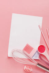 Kitchen pastry, confectionery and sweets on a pink background. Top view. Copy space.