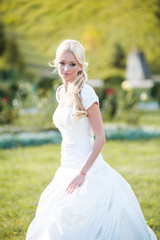 Beautiful sensual bride blonde in wedding dress 