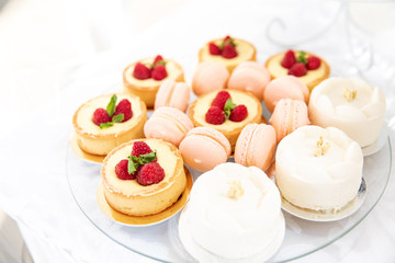 Assortment of pieces of cake on messy table