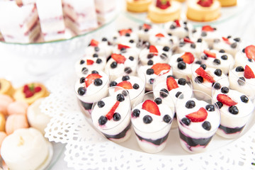 Assortment of pieces of cake on messy table